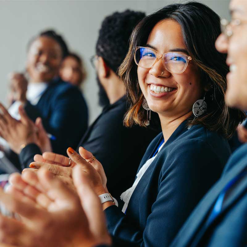 group of employees clapping